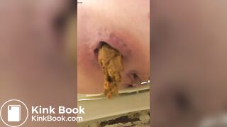 Chick Grunting Out Big Log in Toilet