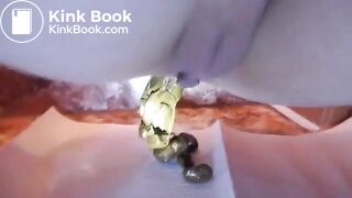 Multiple close up poops on bathroom floor 1