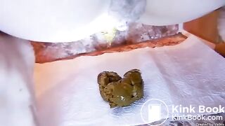 Multiple close up poops on bathroom floor 3
