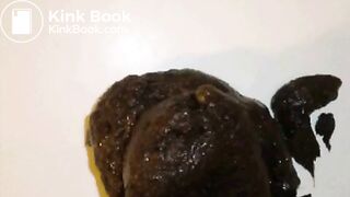 On her side shitting on a countertop