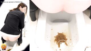 Young Woman in a Suit Pooping