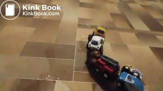 she fastened toy cars with her shit in the train