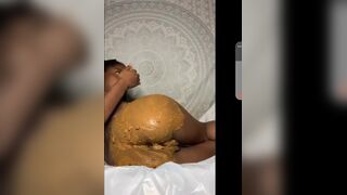 Smearing her ass with shit and tasting it