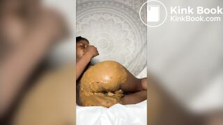 Smearing her ass with shit and tasting it