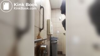 Woman has diarrhea on bathroom wall
