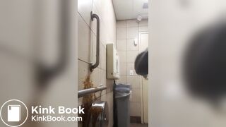 Woman has diarrhea on bathroom wall