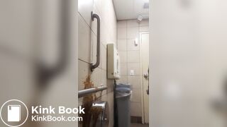 Woman has diarrhea on bathroom wall