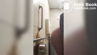Woman has diarrhea on bathroom wall