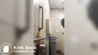 Woman has diarrhea on bathroom wall