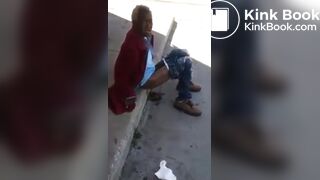 Old and homeless woman pooping in the streets.