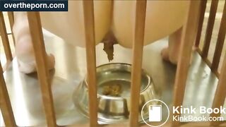 Milf goes into a cage and shit in a dog bowl