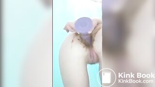 Teenage scat whore plays with dildo