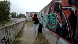 a vacant lot near residential buildings is a toilet for her