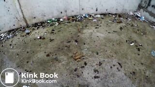 a vacant lot near residential buildings is a toilet for her