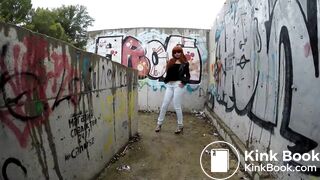 a vacant lot near residential buildings is a toilet for her