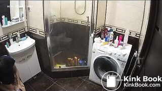 A young chick pooping in bathroom while using phone