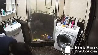 A young chick pooping in bathroom while using phone