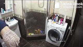 A young chick pooping in bathroom while using phone