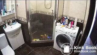 A young chick pooping in bathroom while using phone