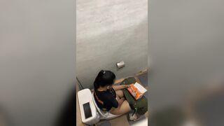 Thai womam pooping in toilet