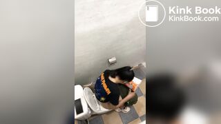 Thai womam pooping in toilet
