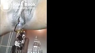Ebony shitting and pissing over toilet