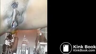 Ebony shitting and pissing over toilet