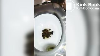 Ebony shitting and pissing over toilet