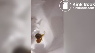 Nasty ebony chick shits in urinal and spits