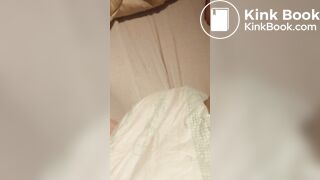 Babygirl loading her nappy