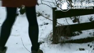 Woman shitting in snow