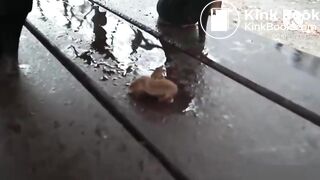 girl shit in rainy weather outdoors and her friend takes pictures on camera