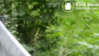Girl in a black turtleneck poops by the road