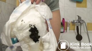 Sexy girl with tattoos messes her diaper