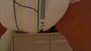 Girl poops diaper and plays