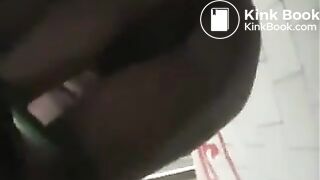 Girl in green bikini takes a dump in a public toilet.