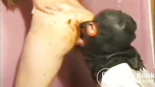 leather scat slave licks the poop from her ass.