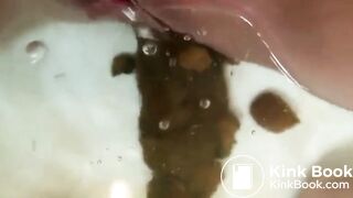 Girl shits huge turd in bathtub