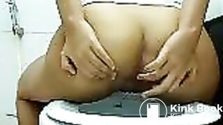 Thai girl shitting in toilet