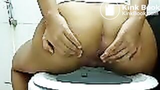 Thai girl shitting in toilet