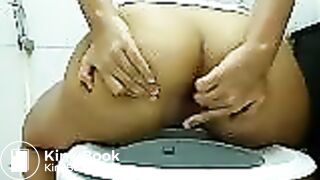Thai girl shitting in toilet