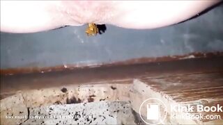 girl is pooping on outdoor toilet