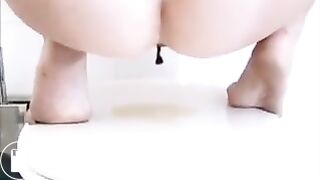 Two girls pooping on the floor
