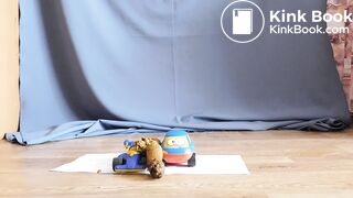 Strange girl is pissing and shitting on toys