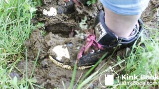 Girl trashing shoes in old cow shit