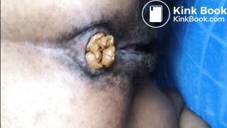 Hairy girl shitting an hard turd