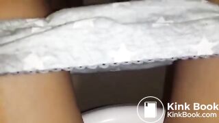Girl having diarrhea in the toilet