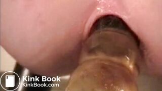 Latex girl dildoes arse and shits