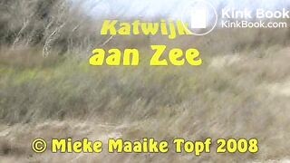 Female shitting in the dunes