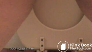 Sexy girl shits over the toilet for us